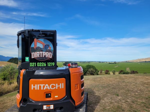 Final grading of cut and fill platform with mountain views