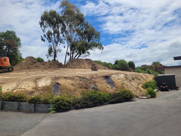 Excavator shaping cut platform on Blenheim hillside