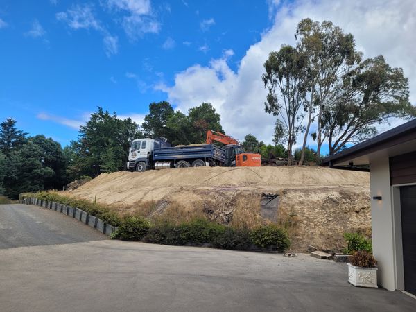 Cut and fill progress showing excavated material on hillside