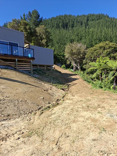 Freshly widened track curving up past the new house, Mahau Sound