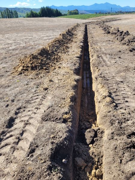 Irrigation trenching on steep site